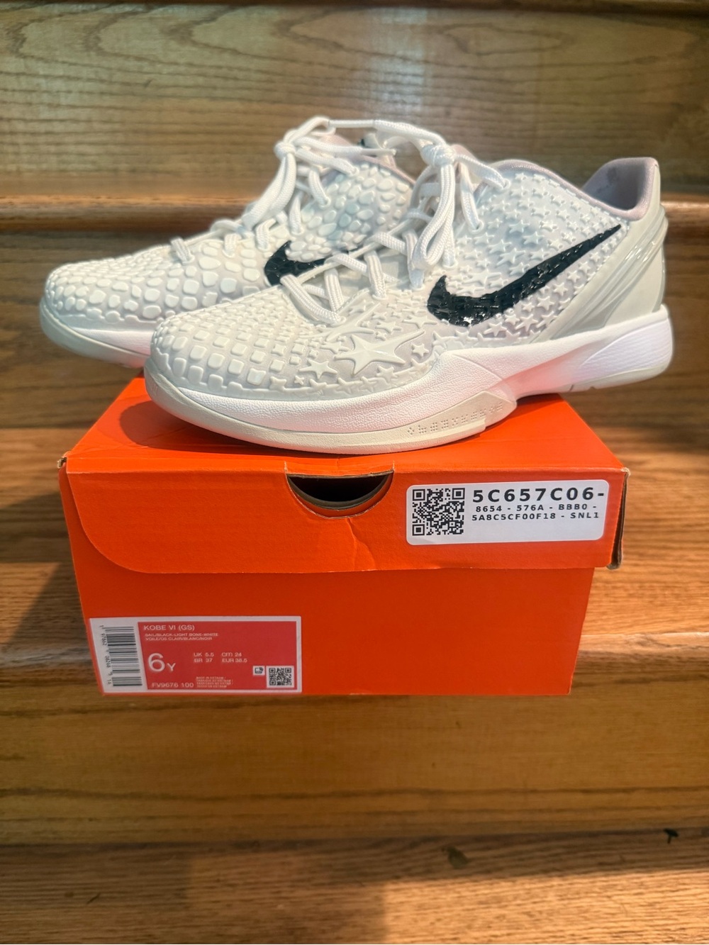 Nike Kids White Sneakers with Black Swoosh